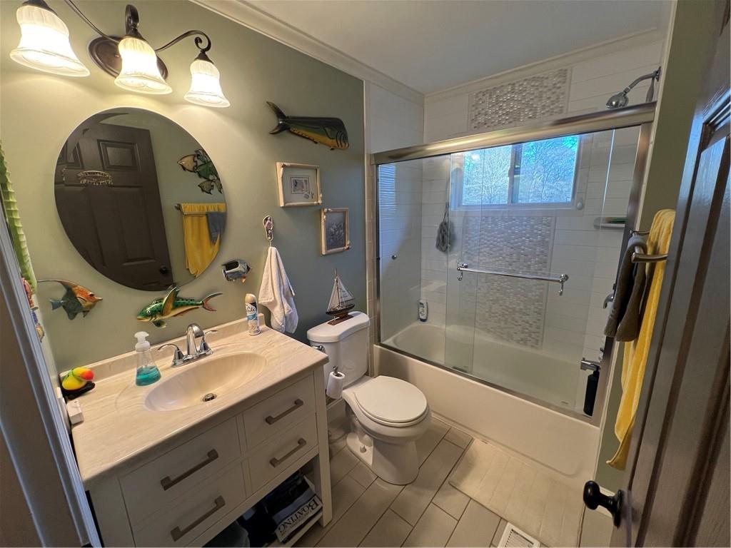 131 Twin Bridges Road Southwest Eatonton, GA 31024 - Photo 33 of 53 a bathroom with a sink a toilet and shower