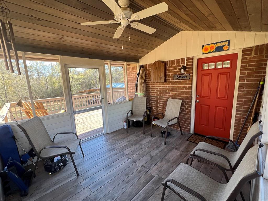 131 Twin Bridges Road Southwest Eatonton, GA 31024 - Photo 36 of 53 a view of a livingroom with lounge chair and a large window