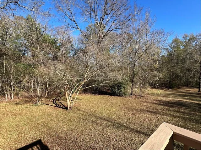 a view of deck with chairs and wooden floor