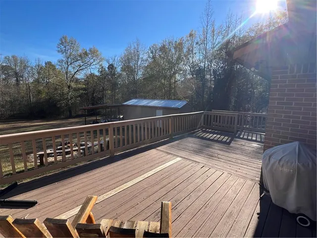 a view of a backyard with large trees