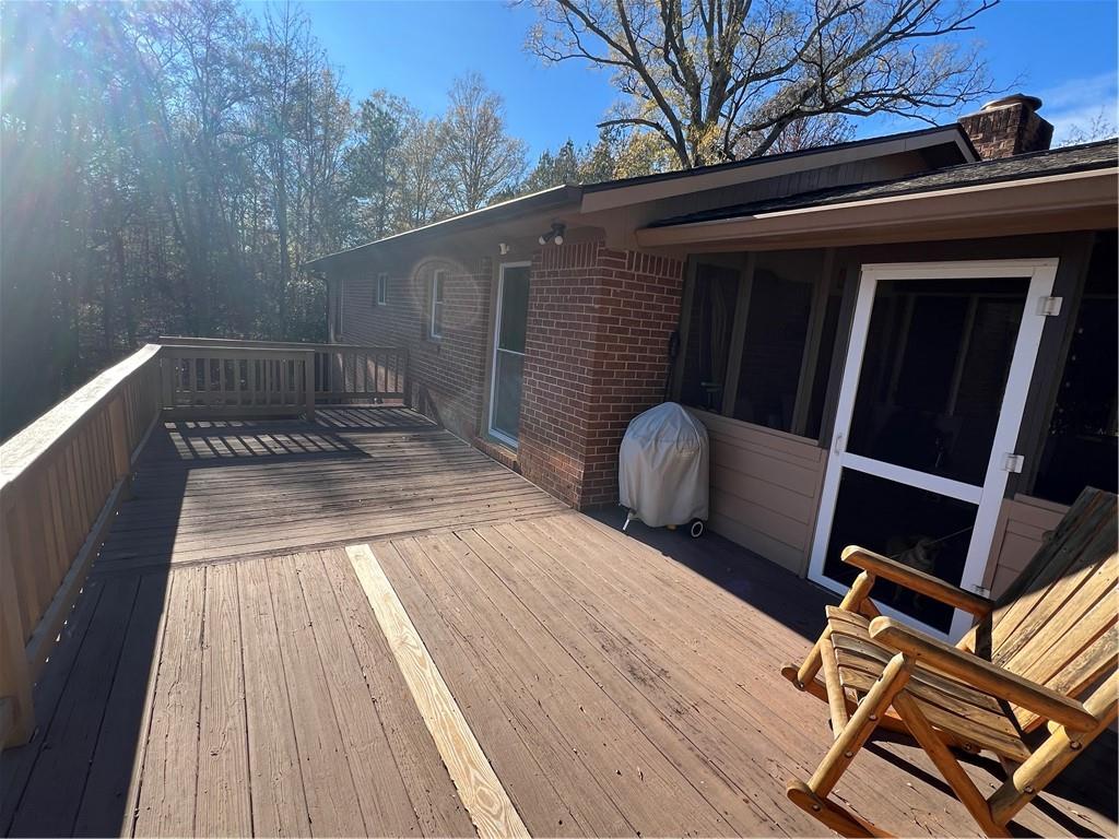 131 Twin Bridges Road Southwest Eatonton, GA 31024 - Photo 43 of 53 a view of deck with chairs and wooden floor