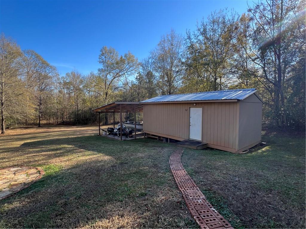 131 Twin Bridges Road Southwest Eatonton, GA 31024 - Photo 44 of 53 a view of a backyard with large trees