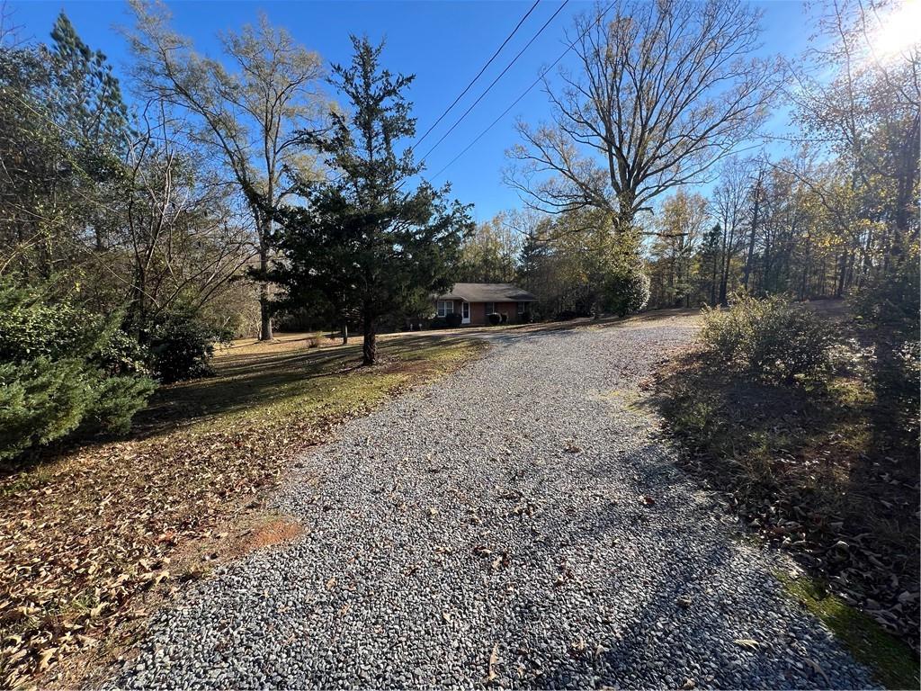 131 Twin Bridges Road Southwest Eatonton, GA 31024 - Photo 5 of 53 a view of a yard with trees