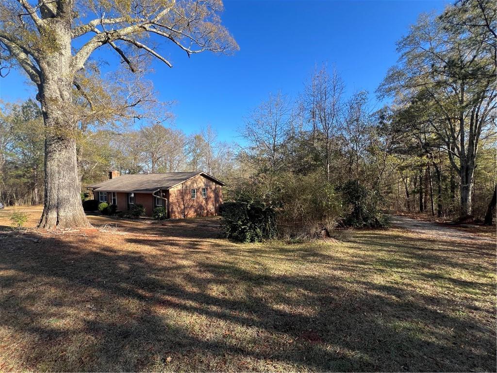 131 Twin Bridges Road Southwest Eatonton, GA 31024 - Photo 10 of 53 a view of a house with a yard