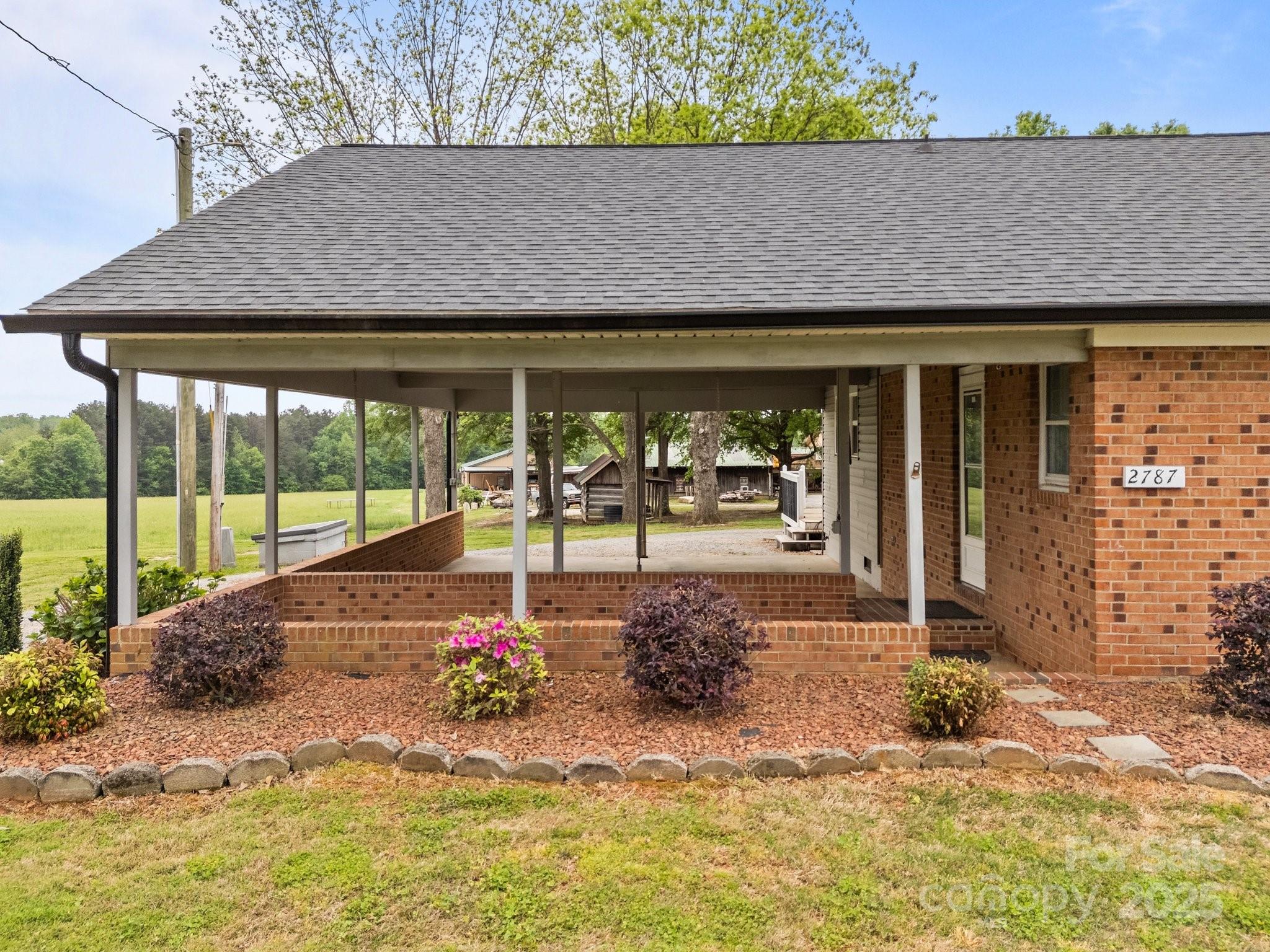 2787 Tyro Road Lexington, NC 27295 - Photo 38 of 46 a view of a house with backyard and porch