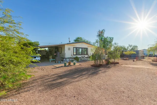 a wooden bench sitting in front of a building
