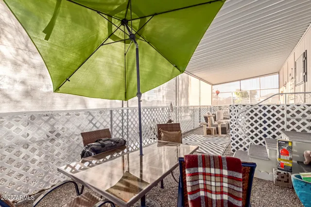 a patio with table and chairs