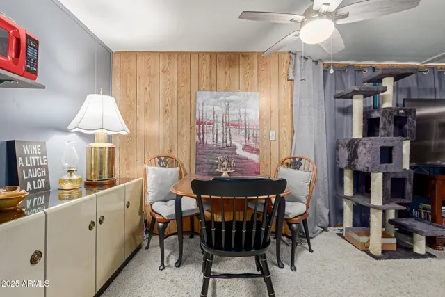 a dining room with furniture and window