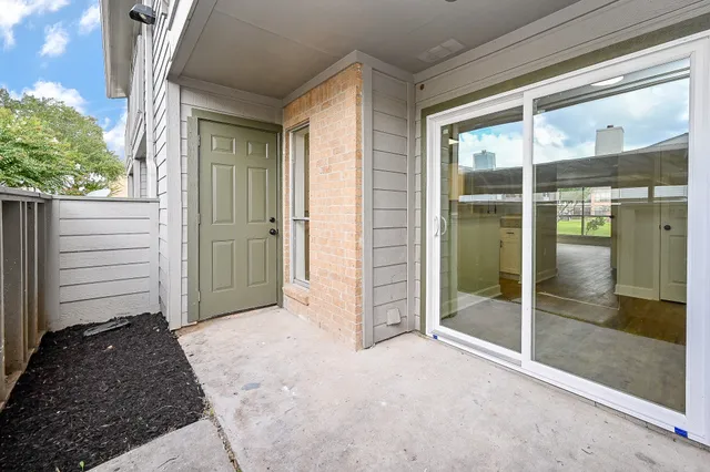 a view of front door and yard