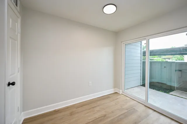 a view of an empty room and window