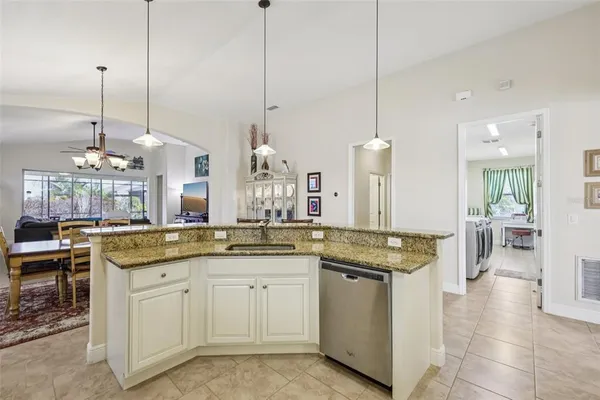 a kitchen with center island and stainless steel appliances