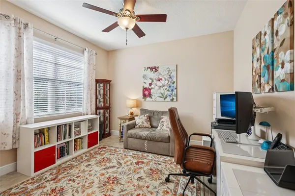 a living room with furniture workspace and a window