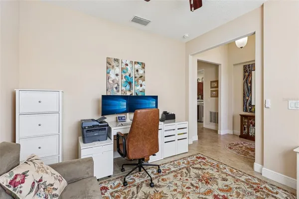a view of a kitchen with a sink and dishwasher a stove top oven with wooden floor