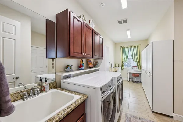 a view of a kitchen with washer and dryer