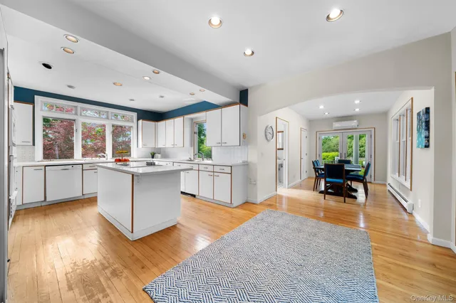 a living room with kitchen island furniture and a large window
