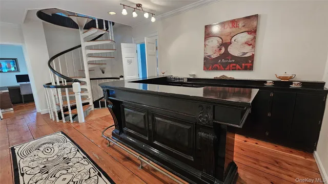 a view of an entryway with wooden floor