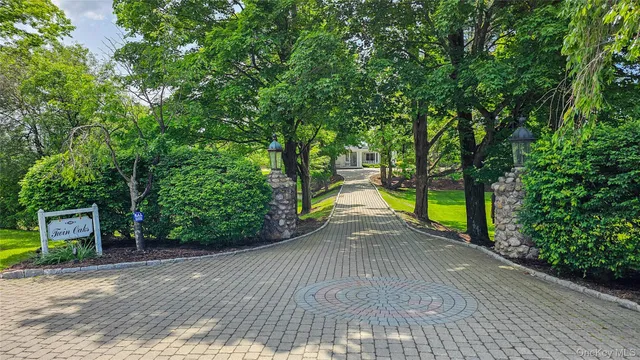 a view of a park with trees in the background