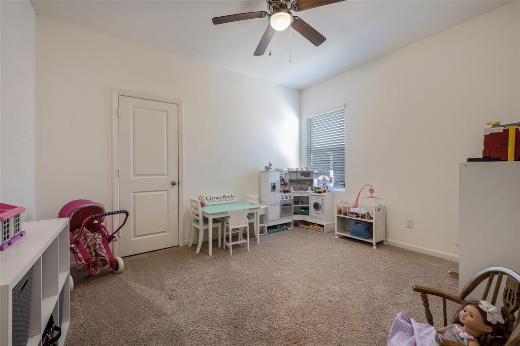 801 Peach Tree Lane Anna, TX 75409 - Photo 10 of 14 a view of a workspace with furniture and a window