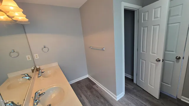 a bathroom with a tub and sink
