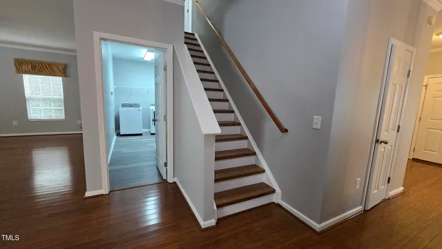 a view of an entryway with wooden floor