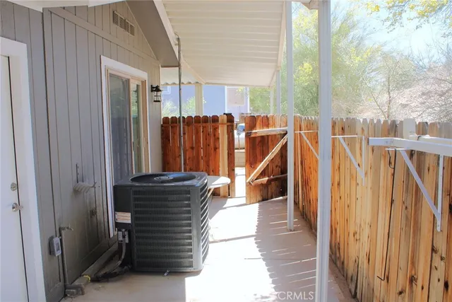 a view of a balcony with furniture