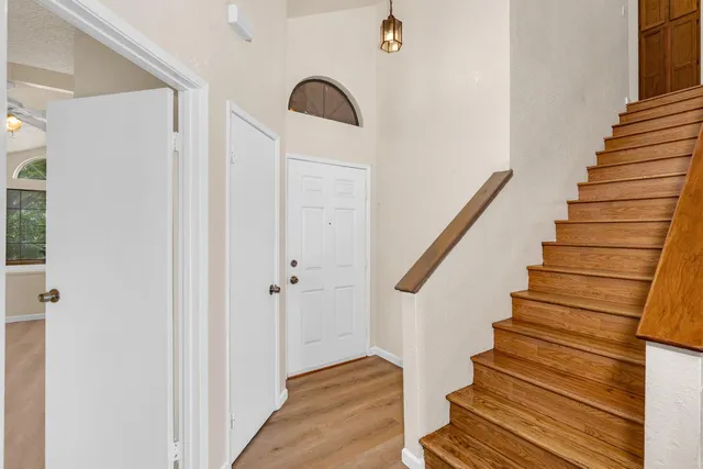 a view of entryway with wooden floor