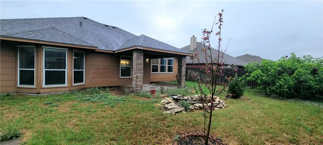 a house view with a garden space