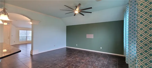 wooden floor and window in an empty room