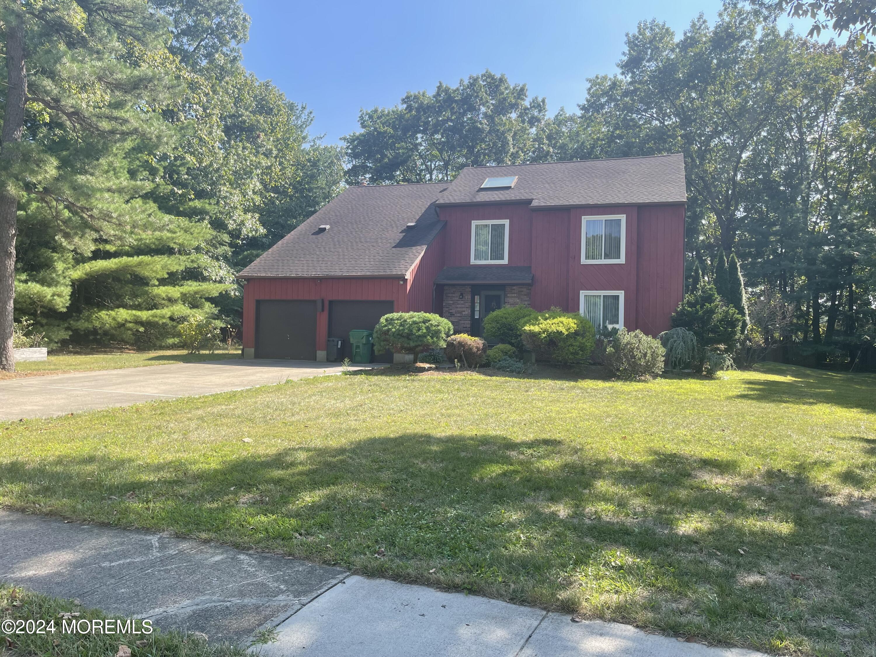4 Rimwood Lane Howell, NJ 07731 - Photo 1 of 44 a front view of a house with yard and green space