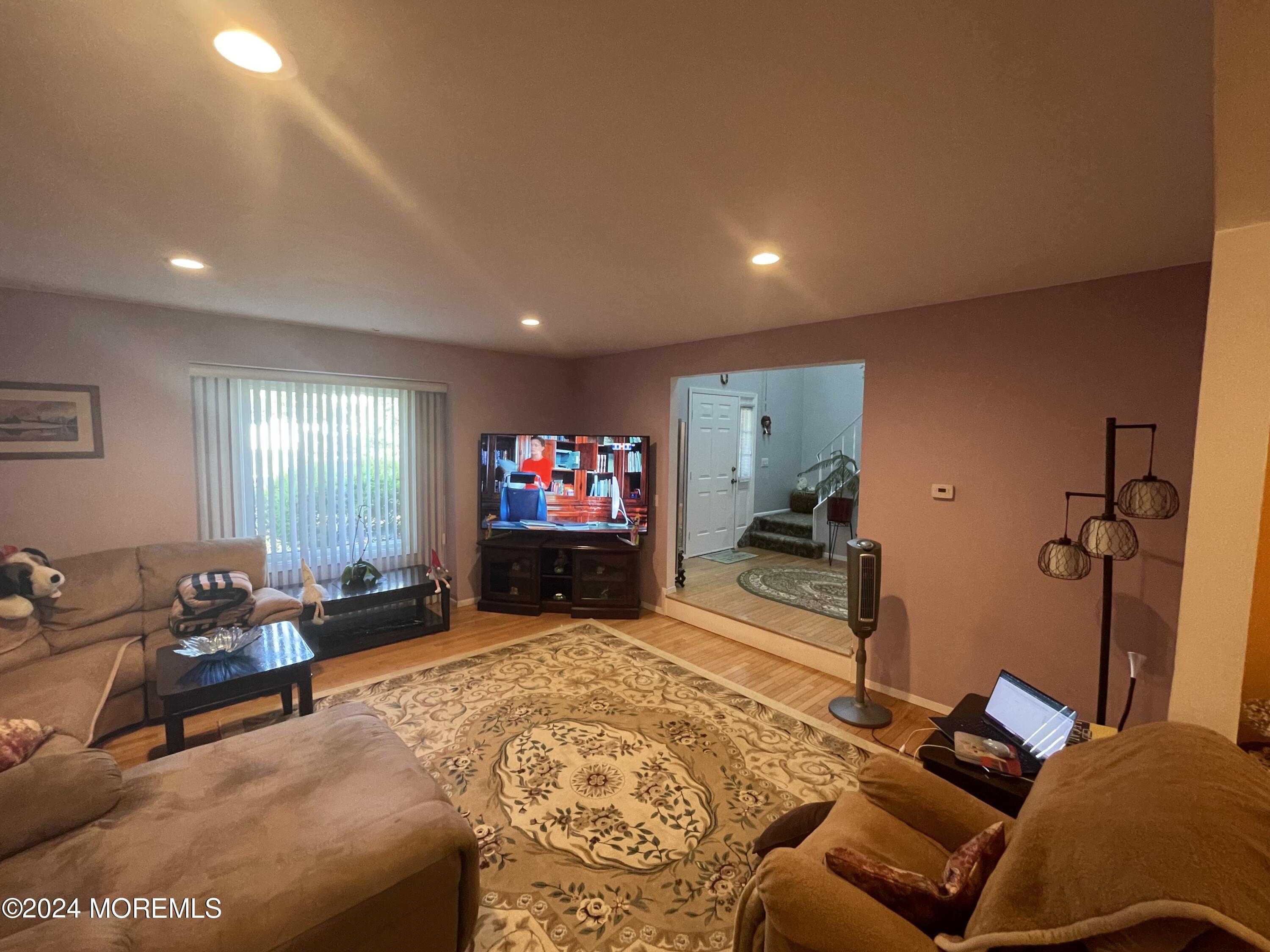 4 Rimwood Lane Howell, NJ 07731 - Photo 16 of 44 a living room with furniture and a flat screen tv