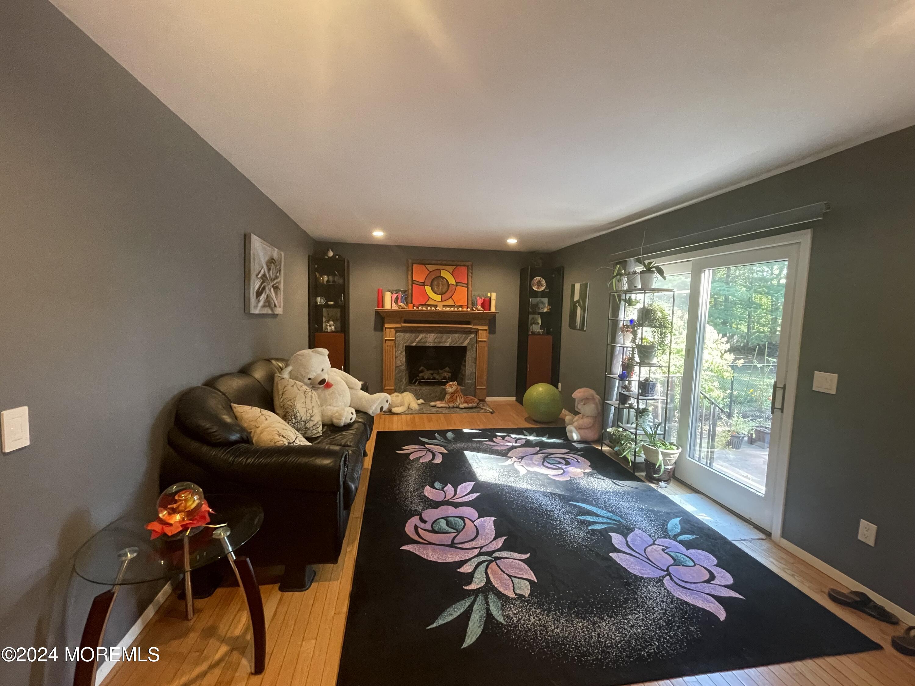4 Rimwood Lane Howell, NJ 07731 - Photo 19 of 44 a living room with furniture and a fireplace