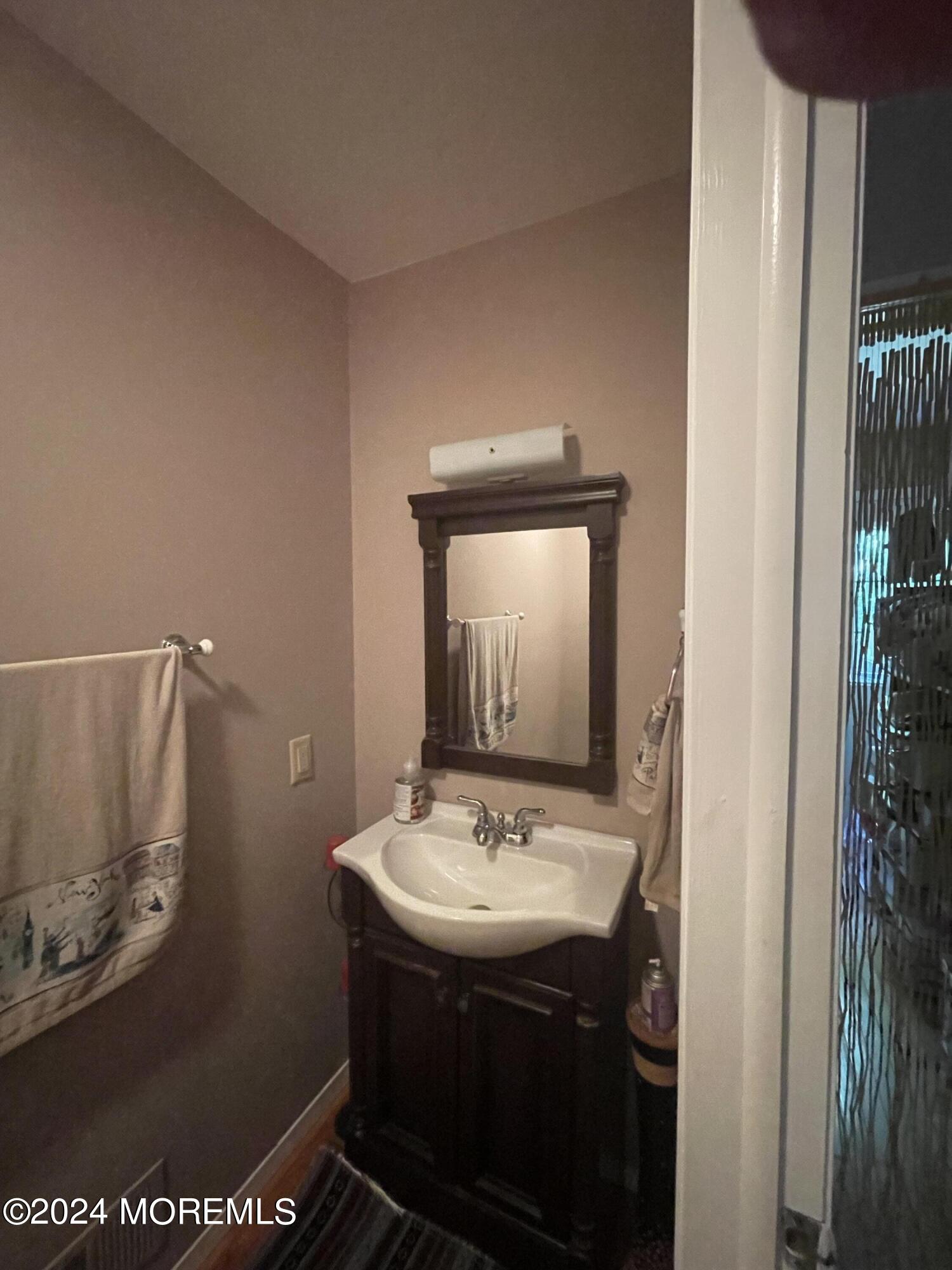4 Rimwood Lane Howell, NJ 07731 - Photo 21 of 44 a bathroom with a sink mirror and vanity