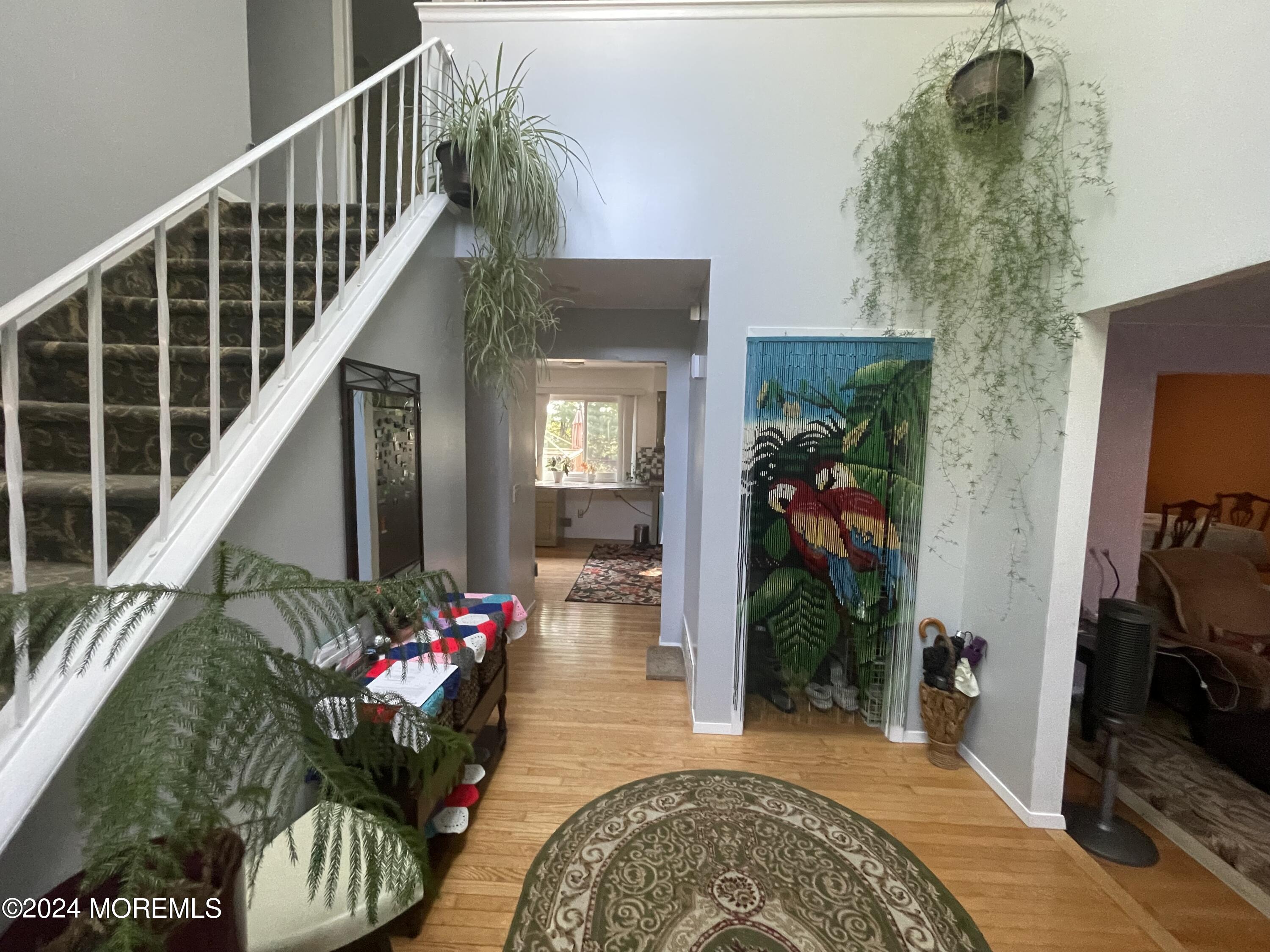 4 Rimwood Lane Howell, NJ 07731 - Photo 22 of 44 a living room with furniture and a potted plant