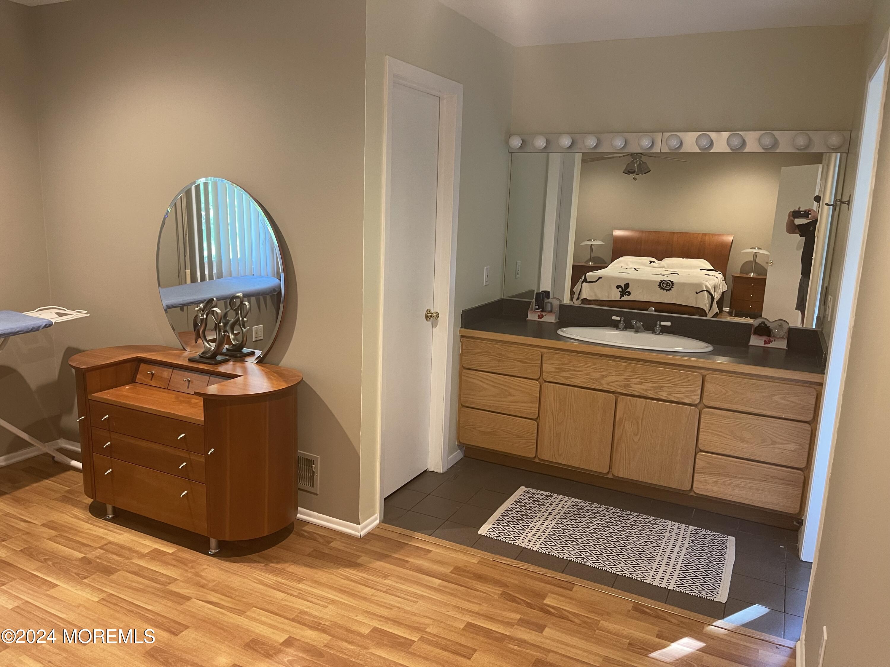4 Rimwood Lane Howell, NJ 07731 - Photo 27 of 44 a room with a mirror and dresser