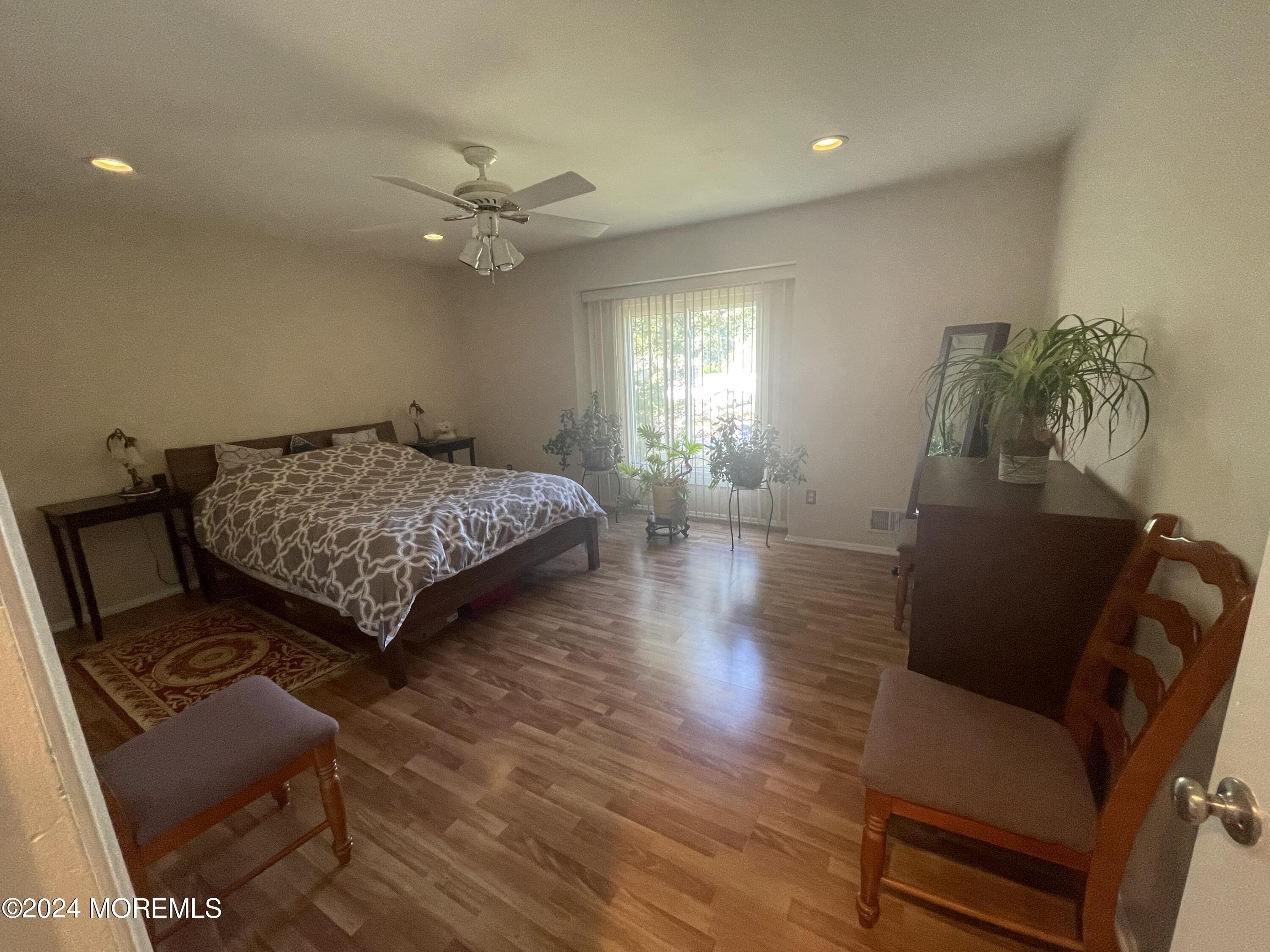 4 Rimwood Lane Howell, NJ 07731 - Photo 31 of 44 a bedroom with a bed window and couch