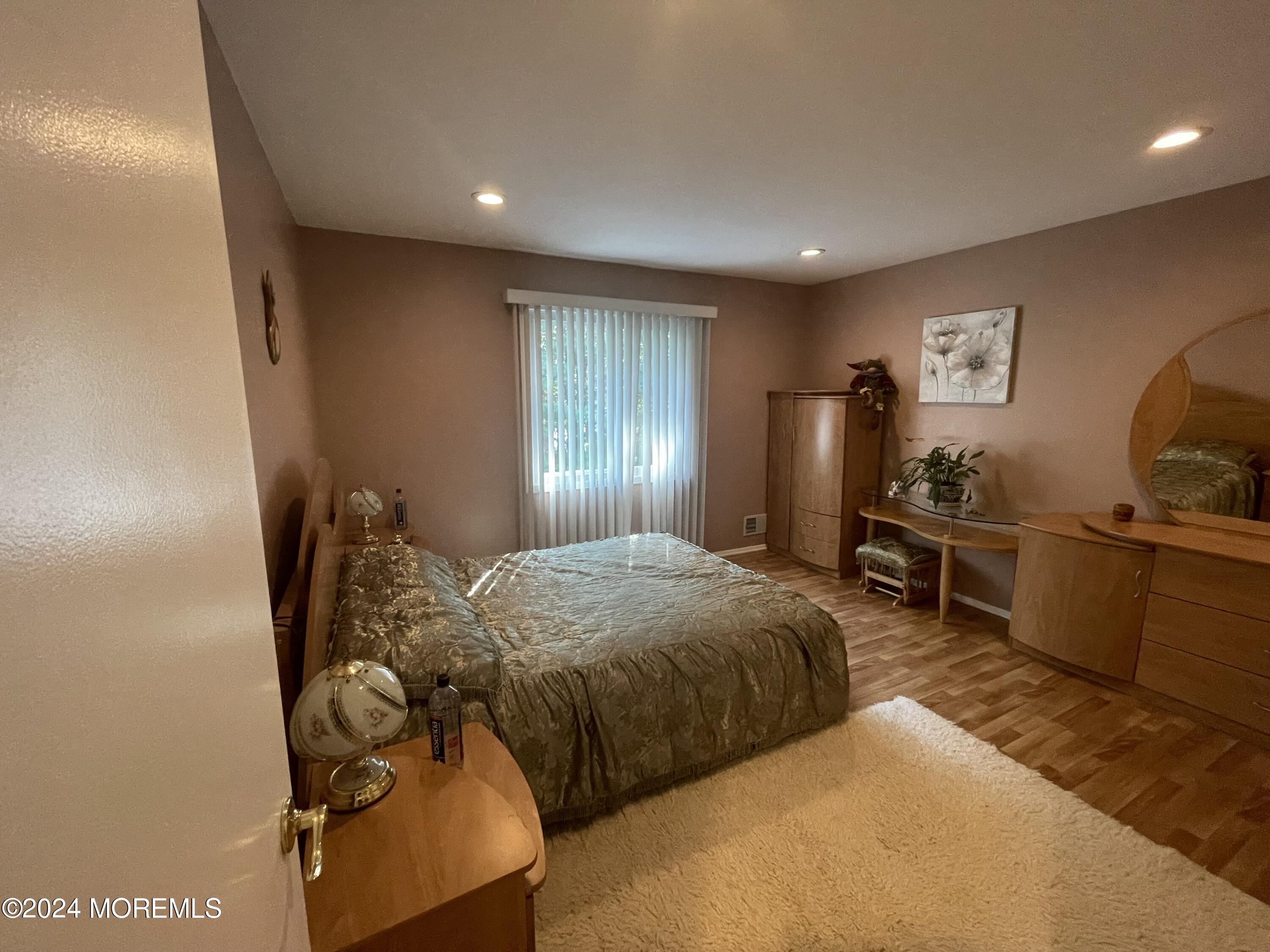 4 Rimwood Lane Howell, NJ 07731 - Photo 32 of 44 a bedroom with bed and window