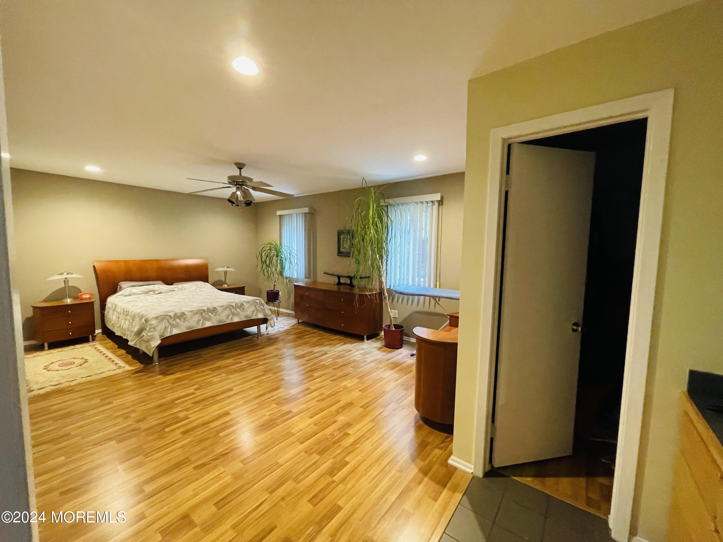 4 Rimwood Lane Howell, NJ 07731 - Photo 41 of 44 a bedroom with a bed and a large mirror