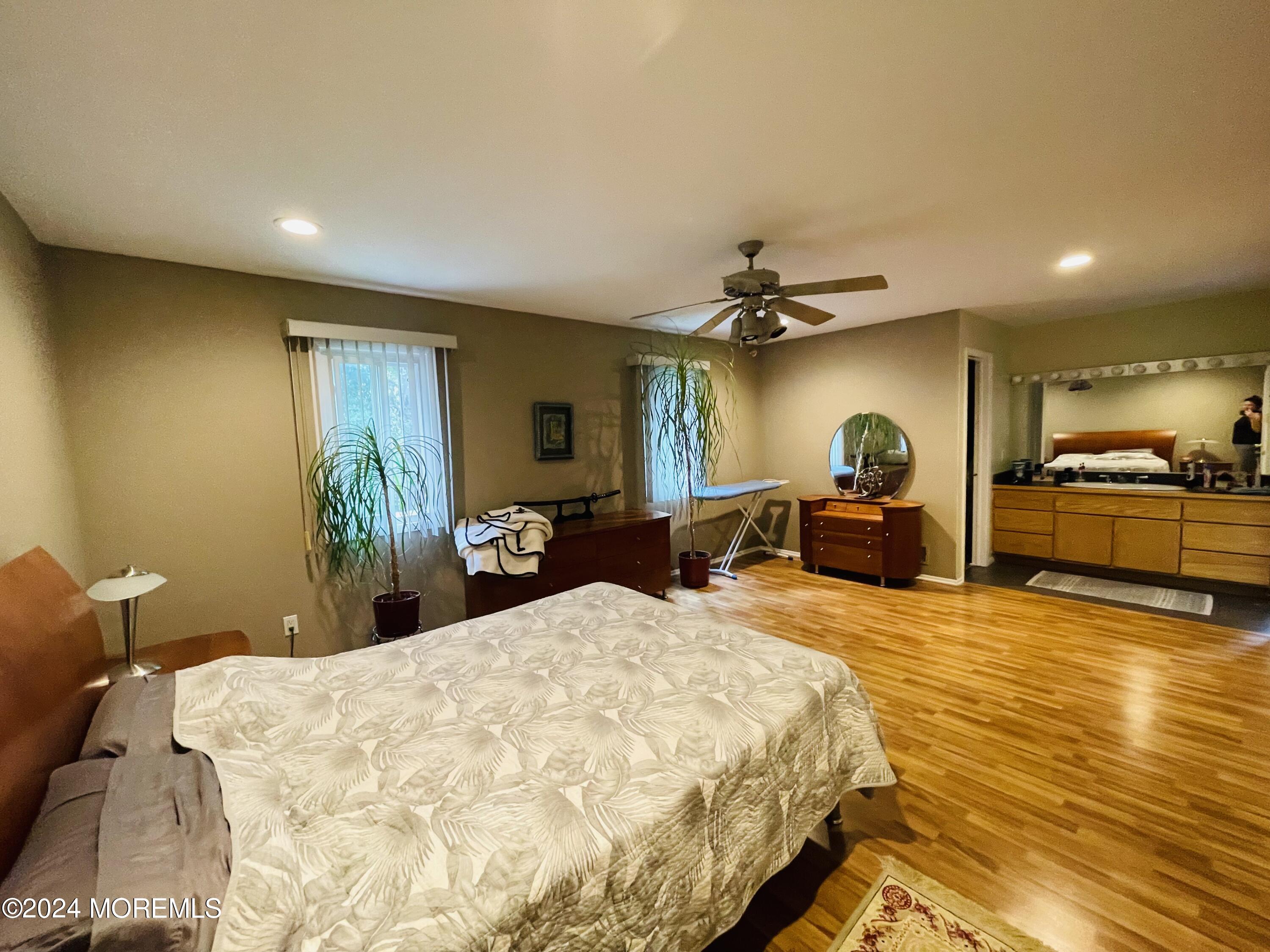4 Rimwood Lane Howell, NJ 07731 - Photo 43 of 44 a bed room with a bed and a television