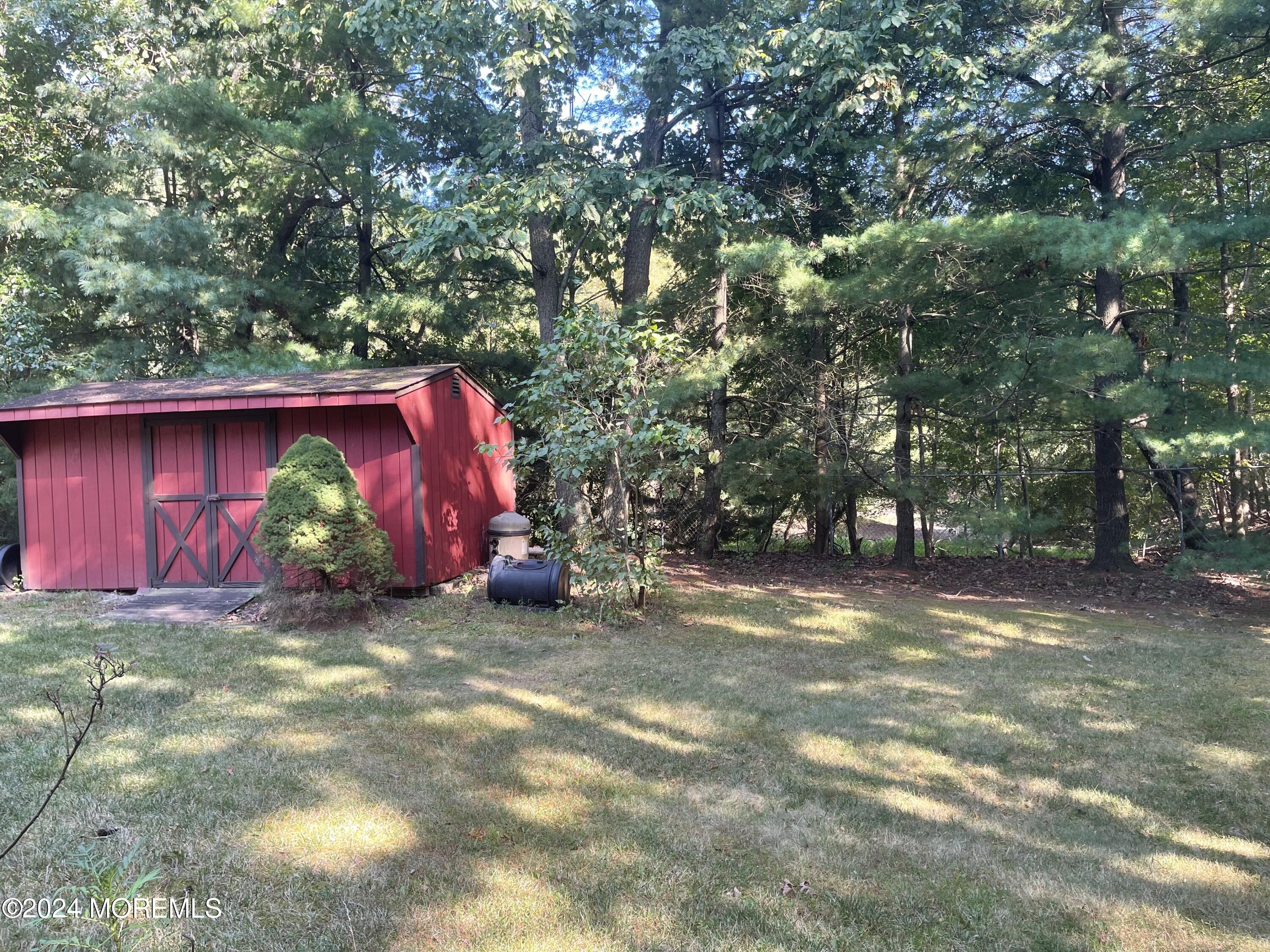 4 Rimwood Lane Howell, NJ 07731 - Photo 7 of 44 a view of a yard with large trees