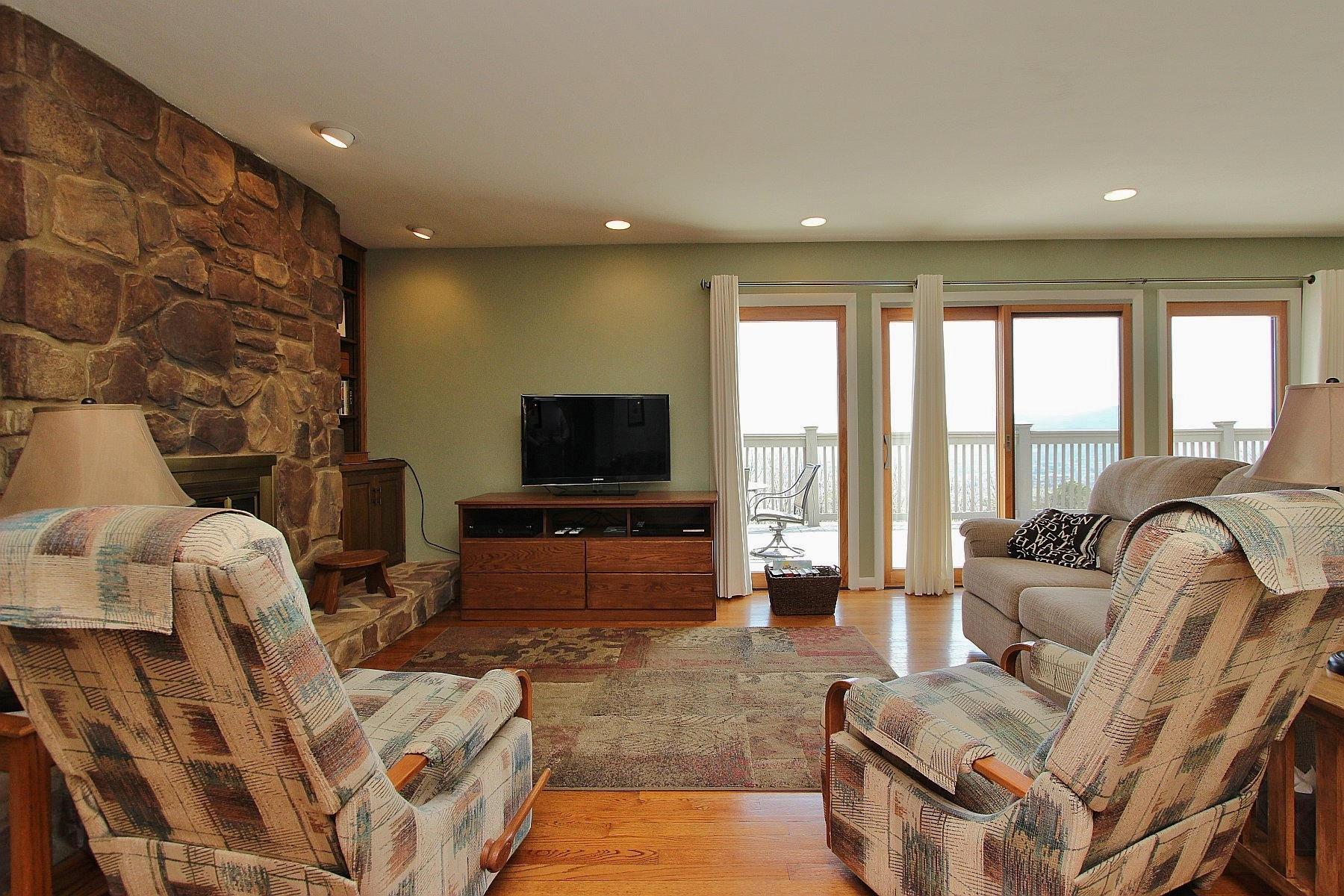 840 Brushy Ridge Road Salem, VA 24153 - Photo 32 of 86 a living room with furniture a flat screen tv and a large window