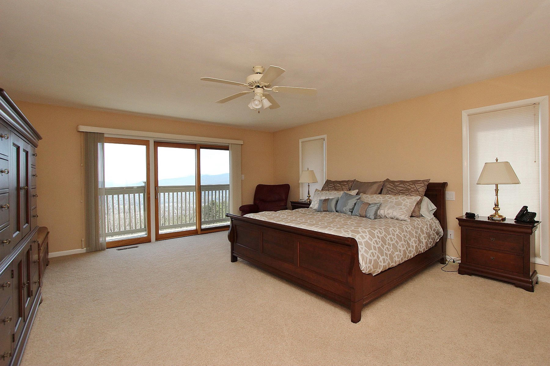 840 Brushy Ridge Road Salem, VA 24153 - Photo 39 of 86 a spacious bedroom with a bed flat screen tv and a large window
