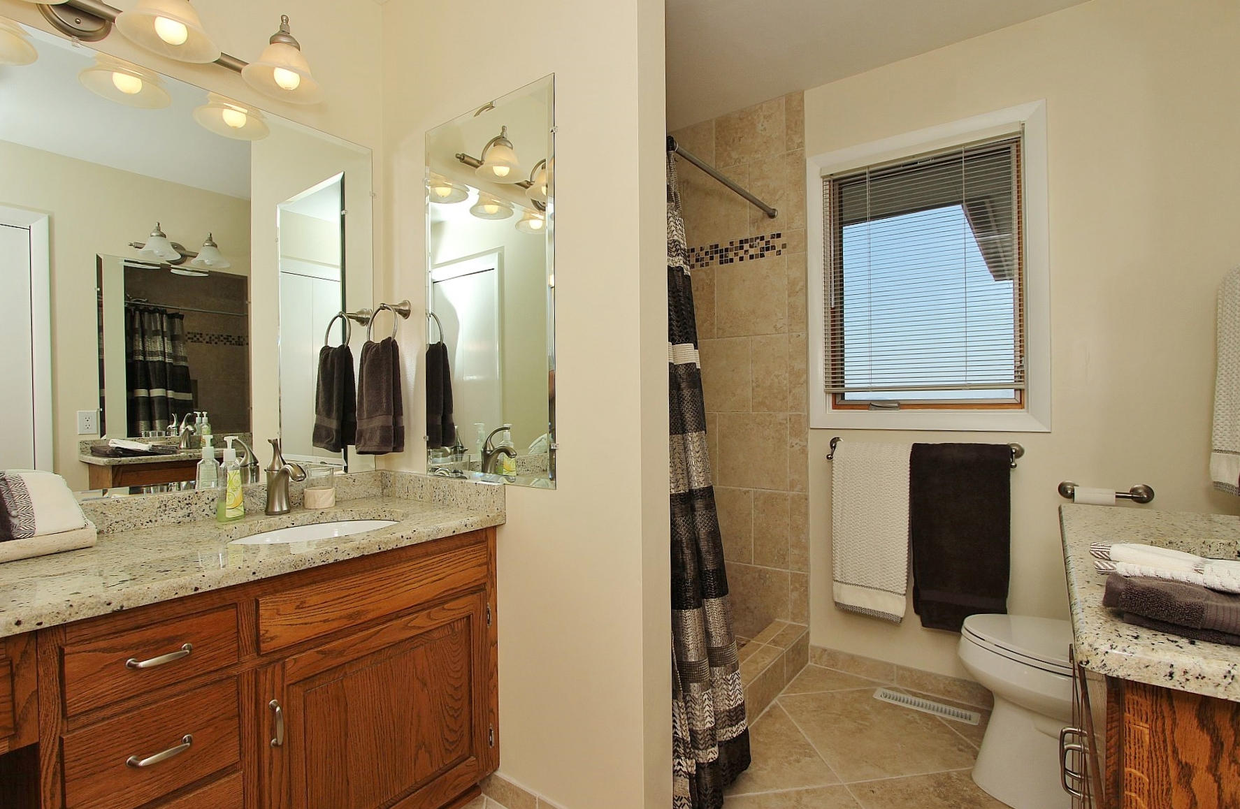 840 Brushy Ridge Road Salem, VA 24153 - Photo 43 of 86 a bathroom with a granite countertop sink toilet and shower