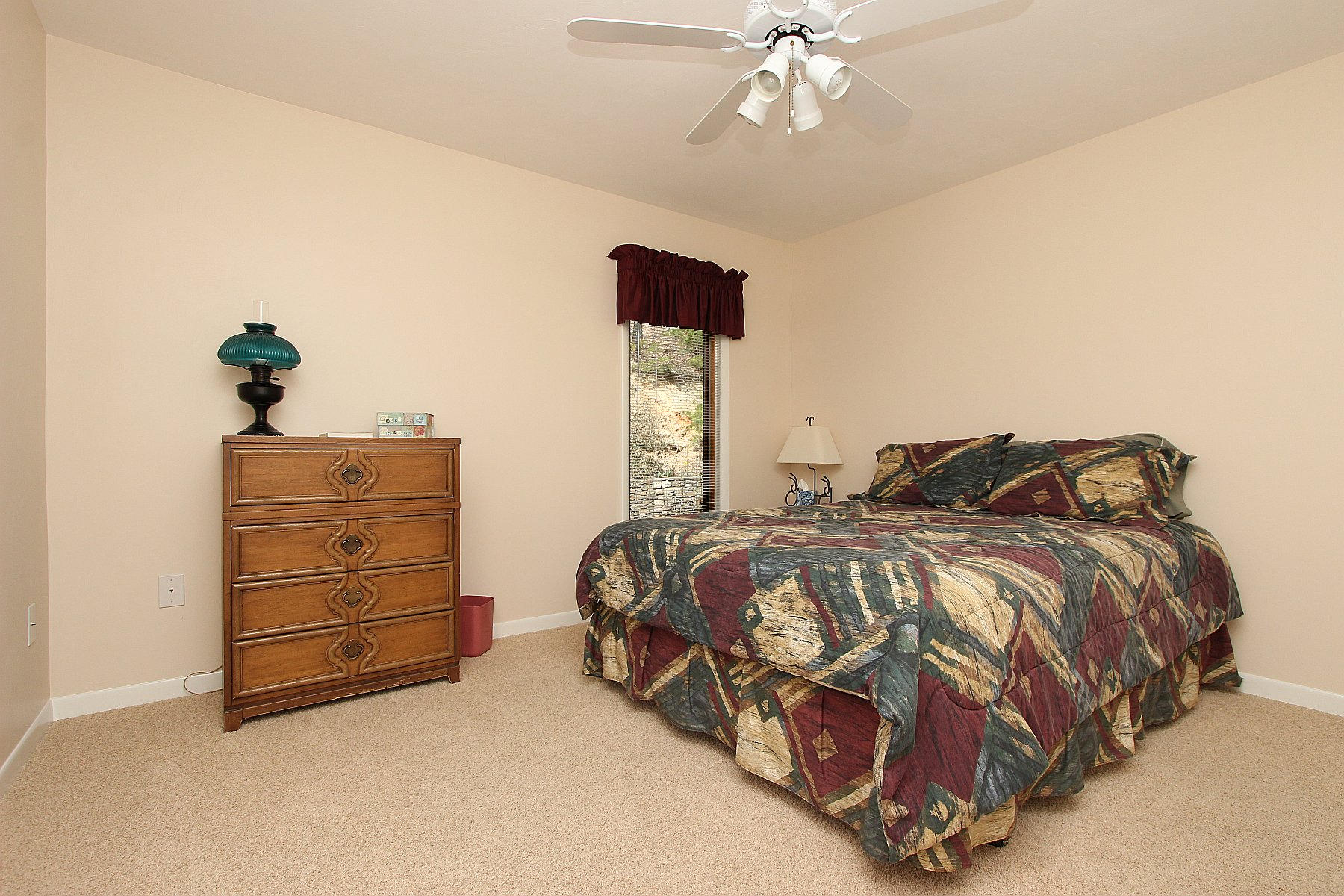 840 Brushy Ridge Road Salem, VA 24153 - Photo 49 of 86 a bedroom with a bed and a chandelier