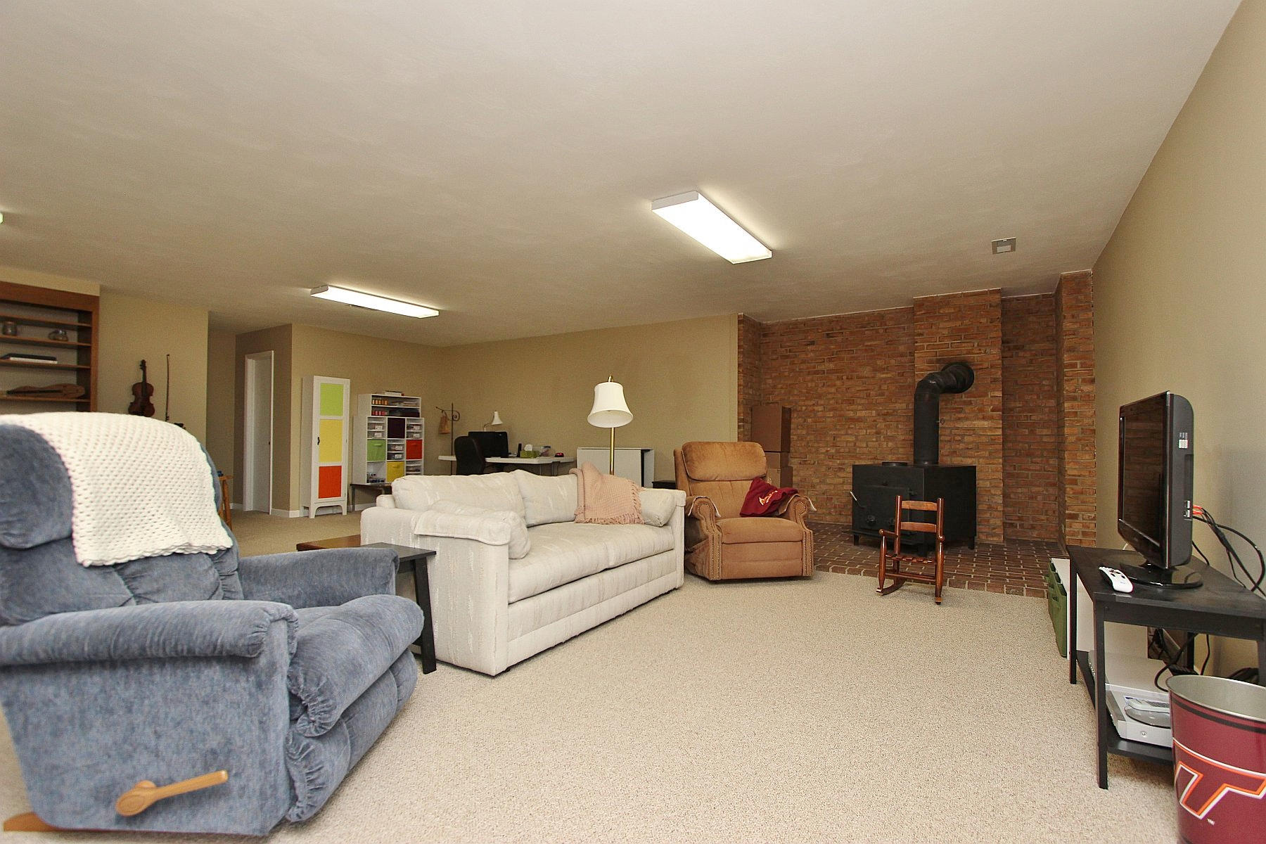 840 Brushy Ridge Road Salem, VA 24153 - Photo 74 of 86 a living room with furniture white walls and a flat screen tv