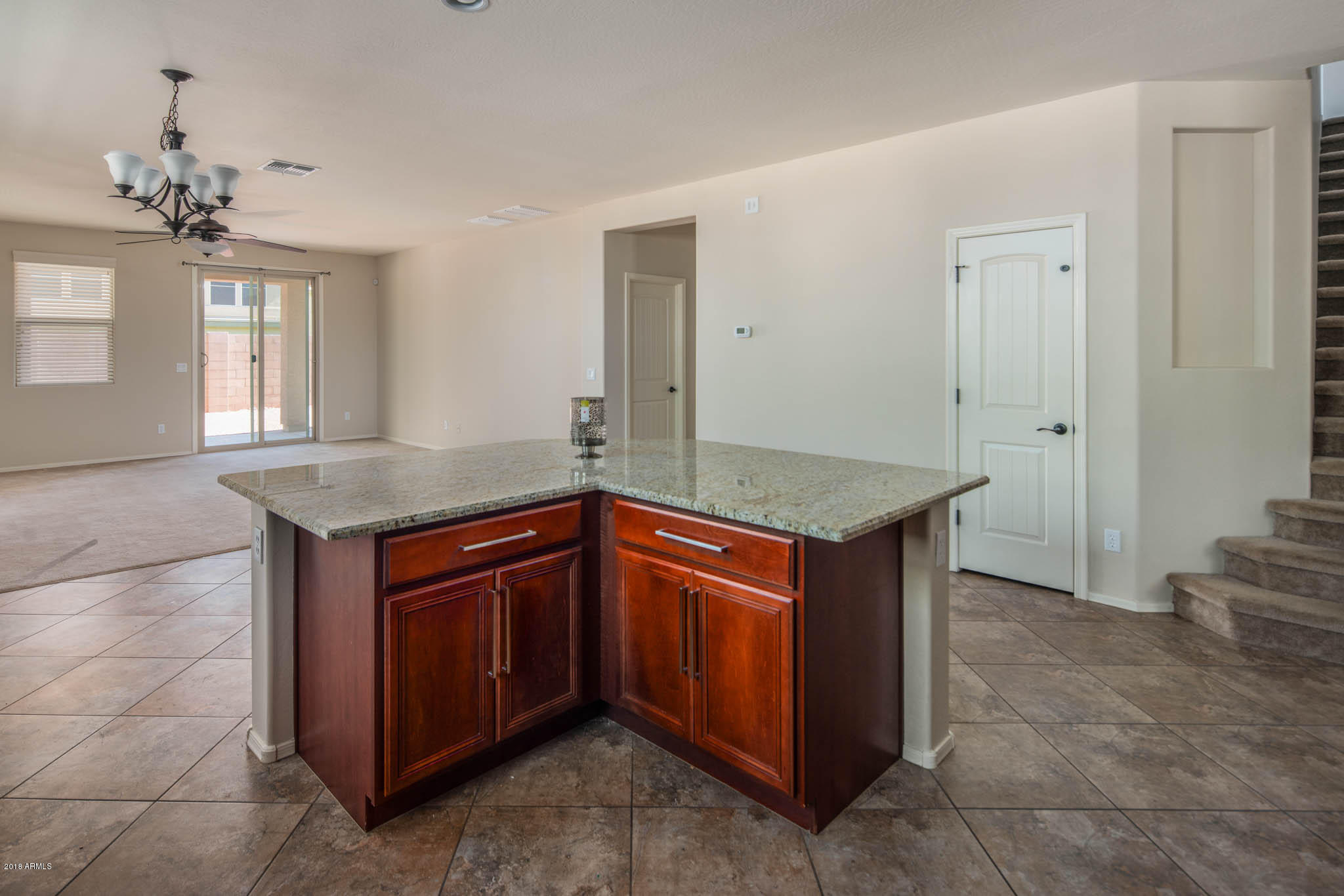 7863 West Redbird Road Peoria, AZ 85383 - Photo 13 of 43 a kitchen with stainless steel appliances granite countertop a sink and a granite counter tops
