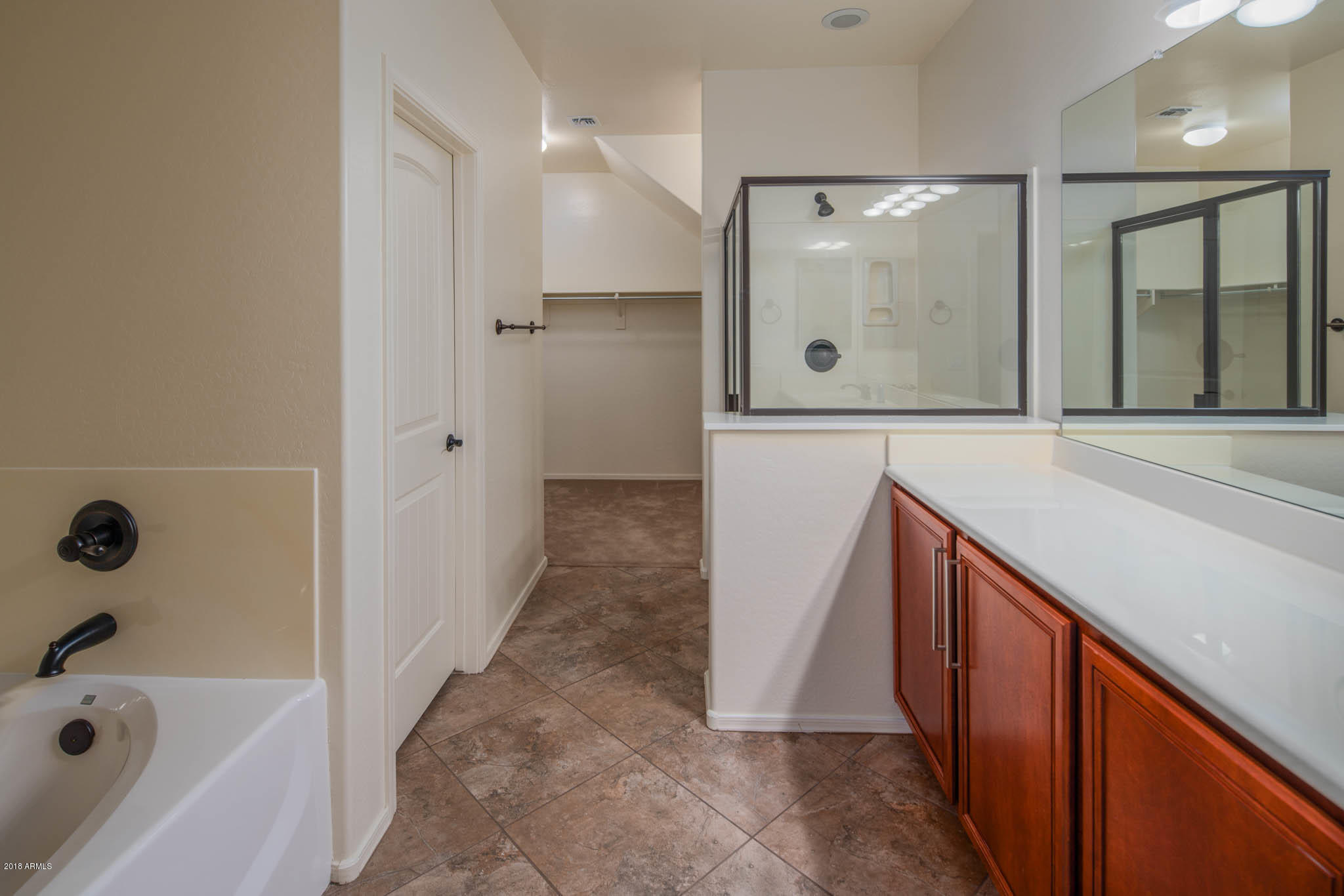 7863 West Redbird Road Peoria, AZ 85383 - Photo 19 of 43 a bathroom with a bathtub and a sink