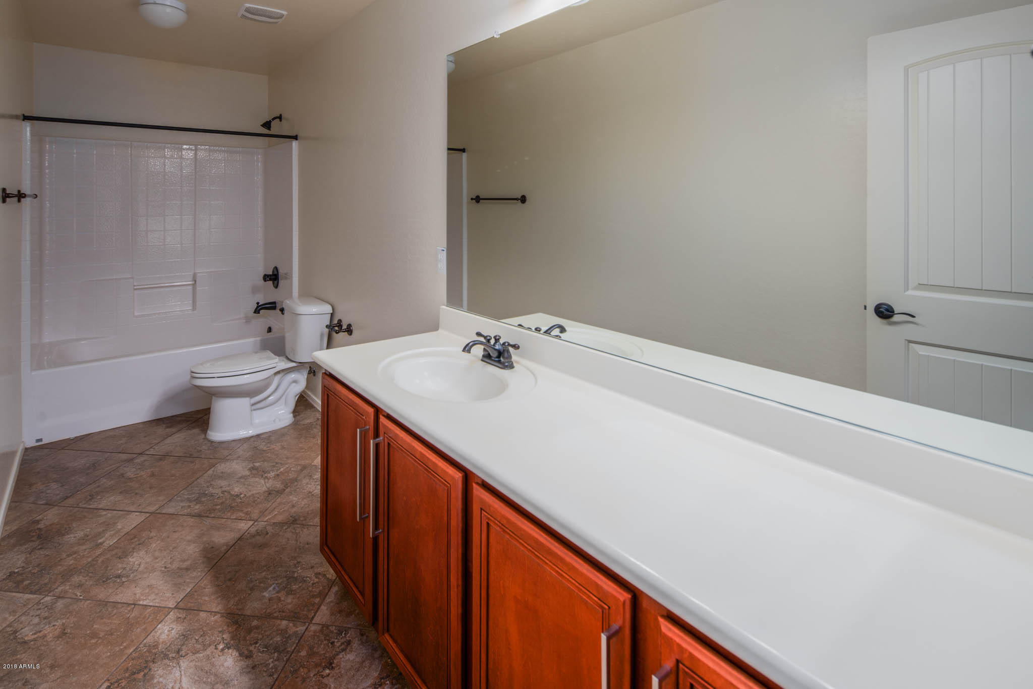7863 West Redbird Road Peoria, AZ 85383 - Photo 25 of 43 a bathroom with a sink a toilet and shower