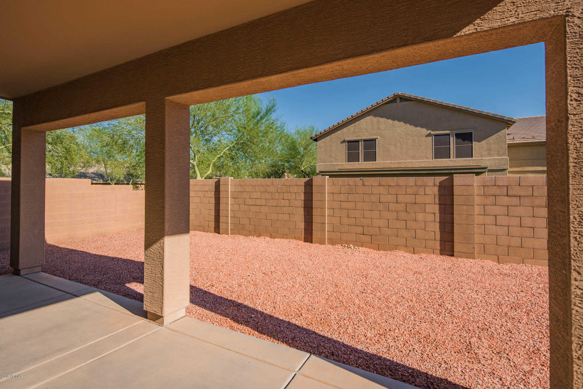 7863 West Redbird Road Peoria, AZ 85383 - Photo 30 of 43 a front view of a house with large windows