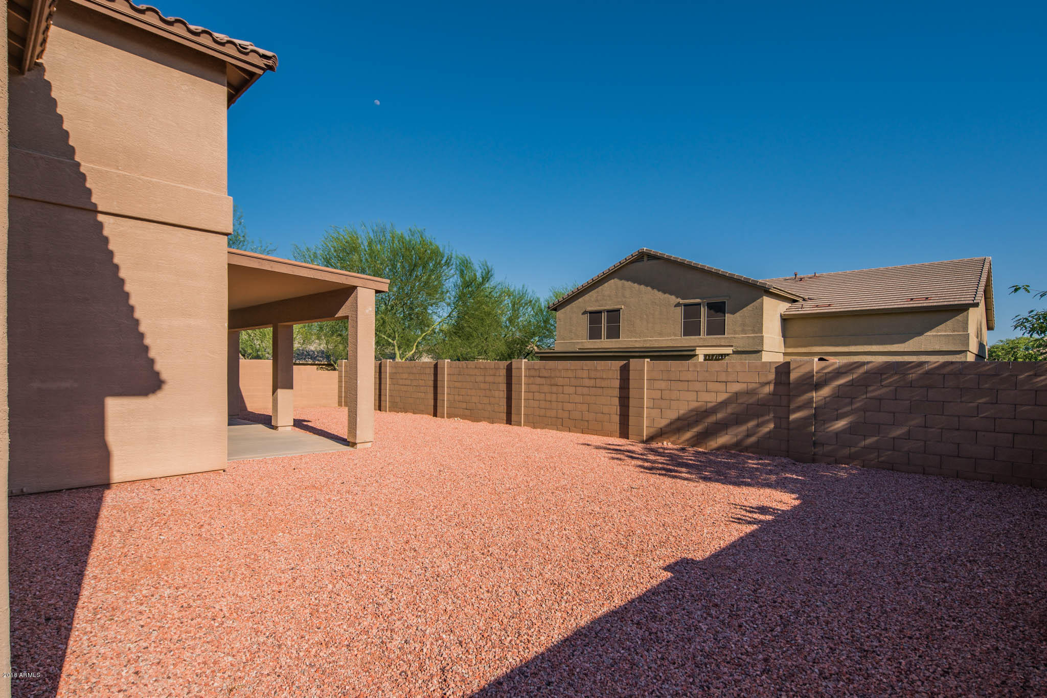 7863 West Redbird Road Peoria, AZ 85383 - Photo 31 of 43 a view of house with yard and deck