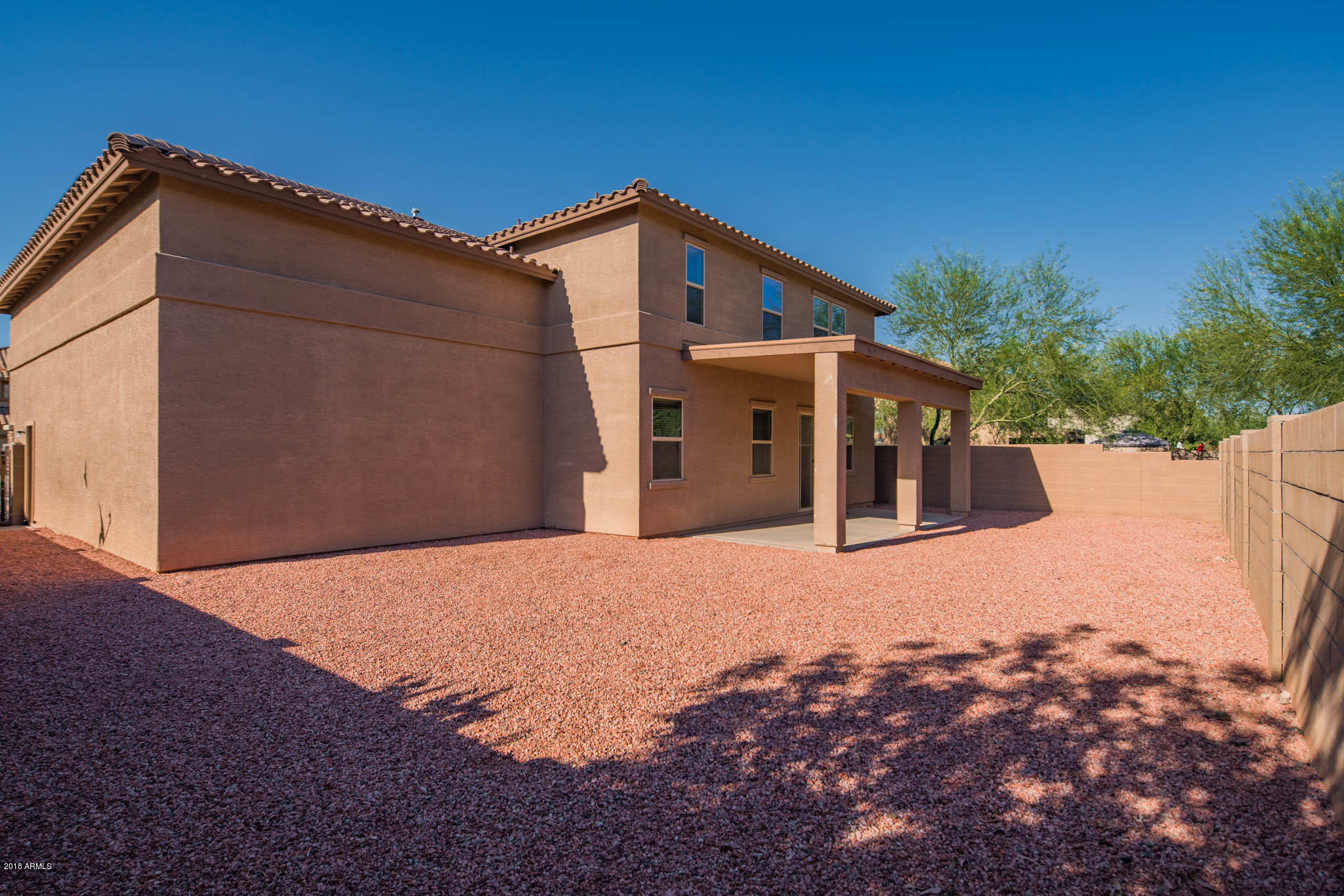 7863 West Redbird Road Peoria, AZ 85383 - Photo 32 of 43 a front view of a house with a yard